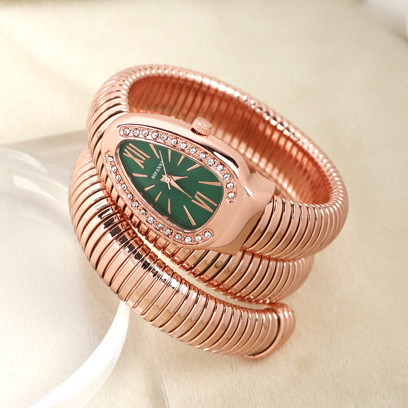 Women's jewelry: elegant snake quartz watch & sophisticated matching bracelet.