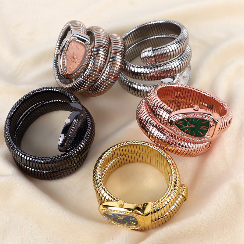 Fashionable snake wrap quartz watch for women with an elegant bracelet accessory.