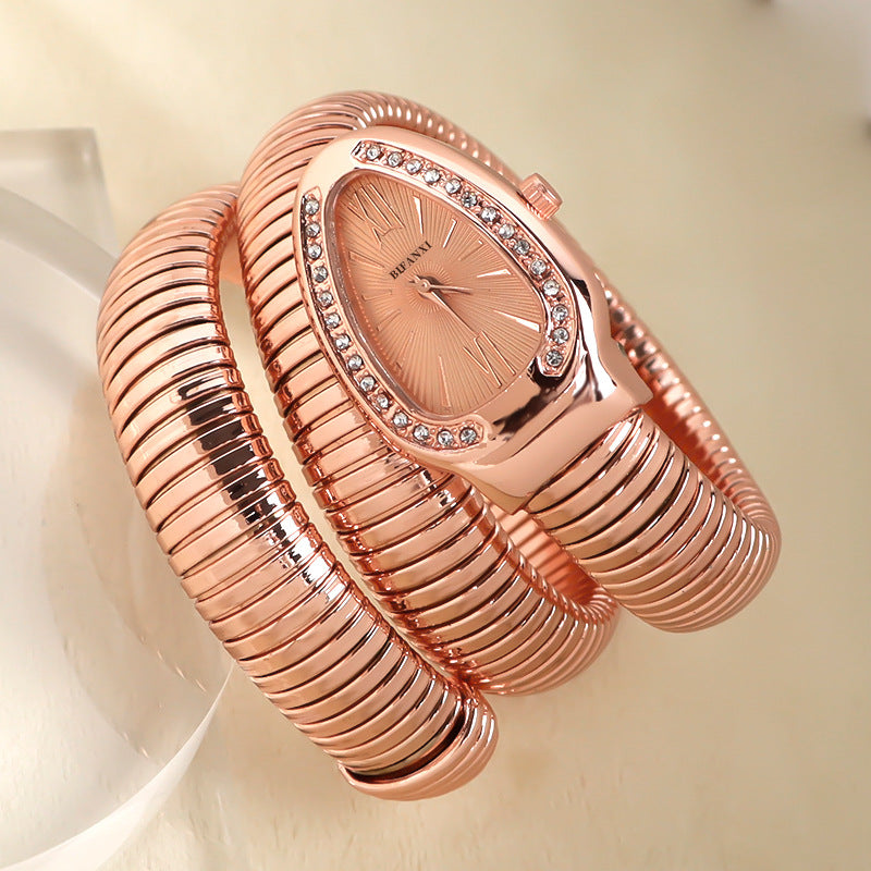 Fashionable women's snake quartz watch & bracelet set, elegant and timeless.
