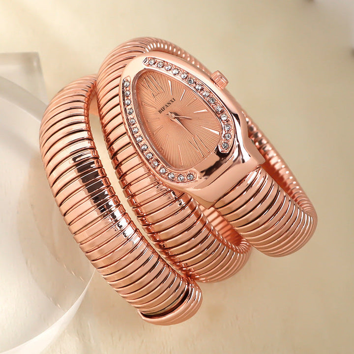 Fashionable women's snake quartz watch & bracelet set, elegant and timeless.