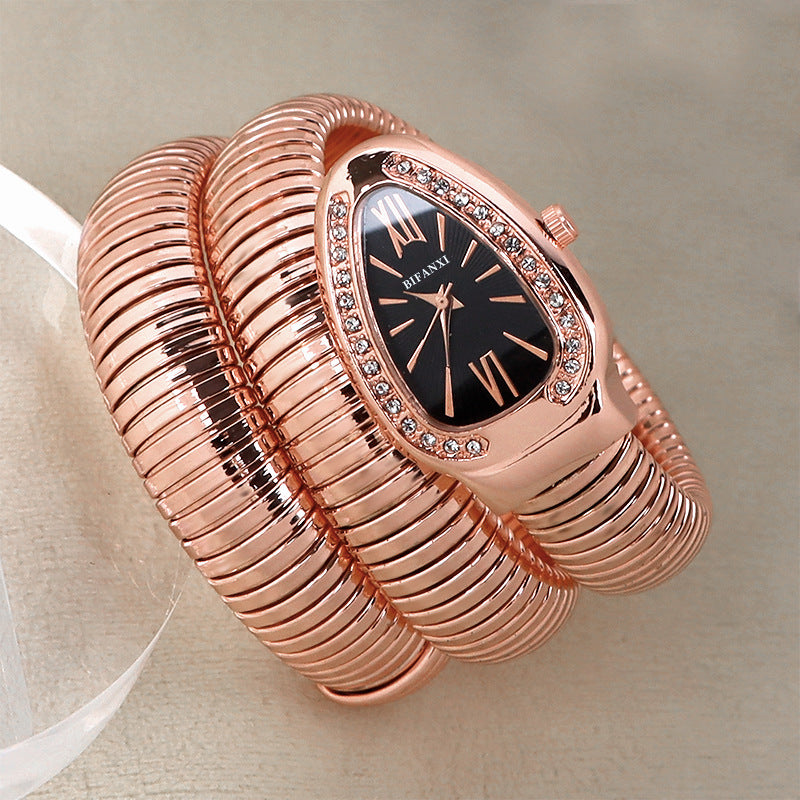 Women's elegant quartz watch, snake detail, and a classy bracelet accessory.