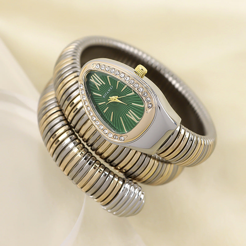 Women's gold-tone snake watch, quartz movement, and chic bracelet for accessories.
