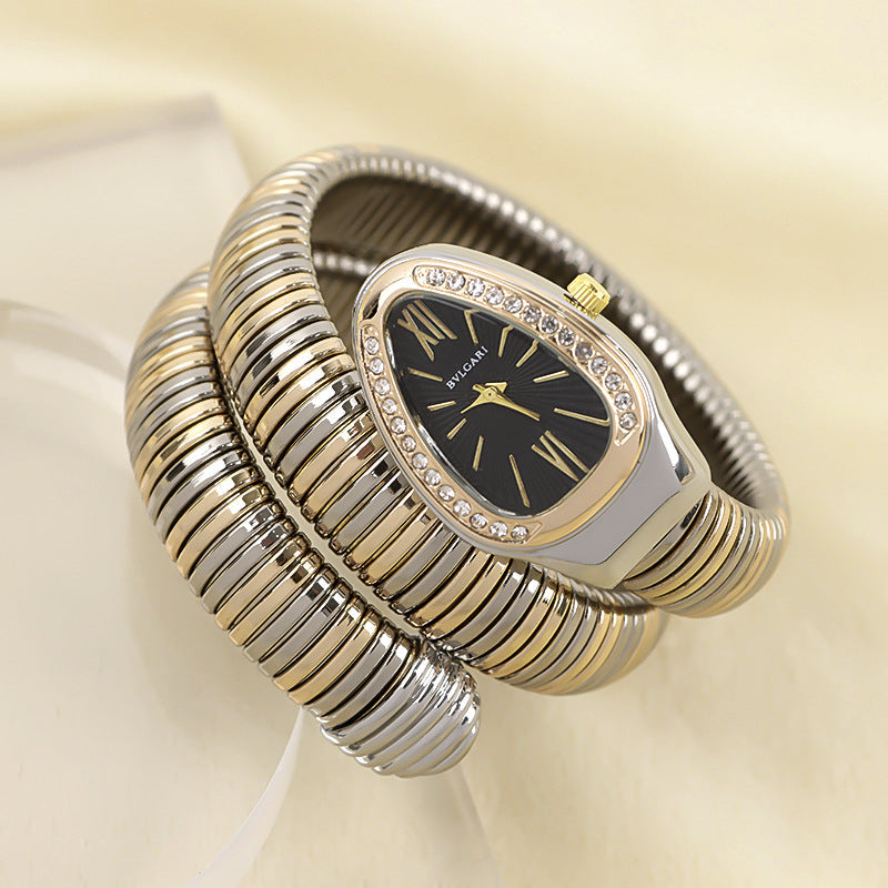 Luxury women's snake quartz watch, fashionable accessory with an elegant bracelet.