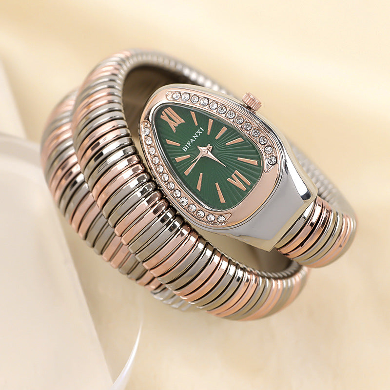 Women's elegant quartz watch featuring a snake motif & a delicate bracelet.