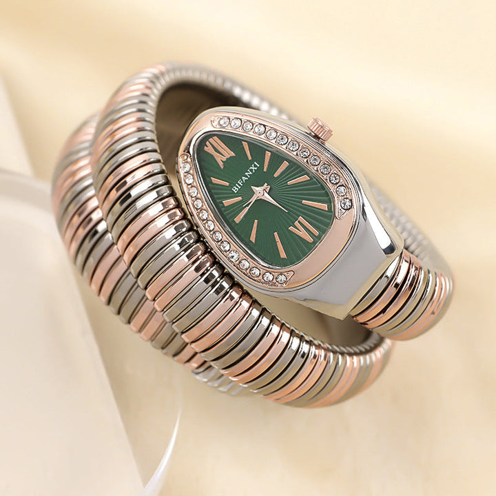 Women's elegant quartz watch featuring a snake motif & a delicate bracelet.