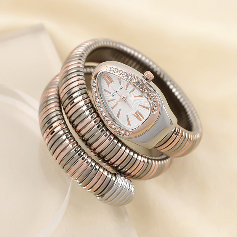 Fashion-forward women's snake quartz watch with an elegant bracelet.