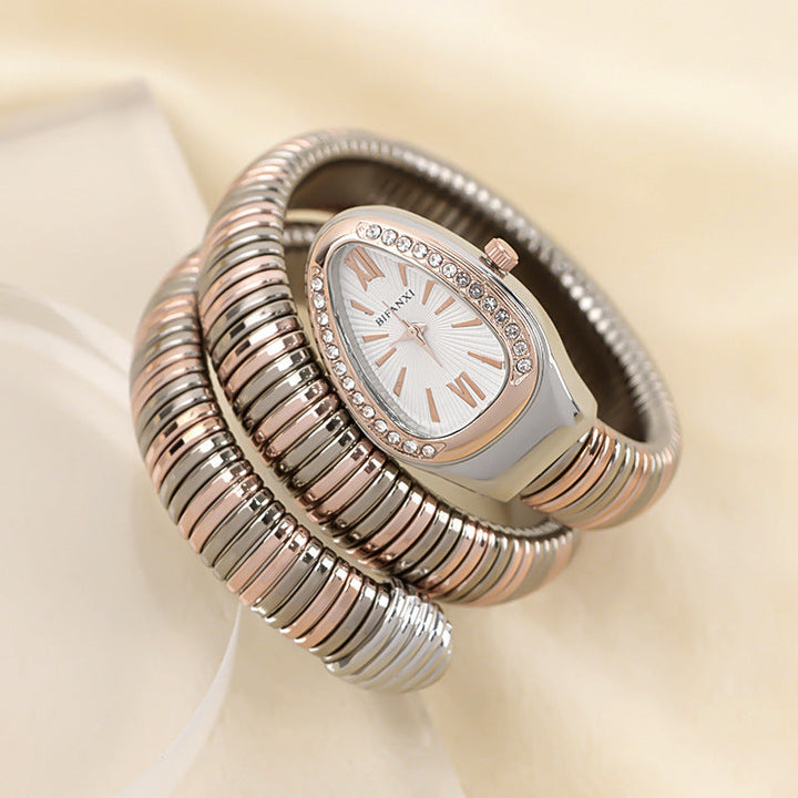 Fashion-forward women's snake quartz watch with an elegant bracelet.