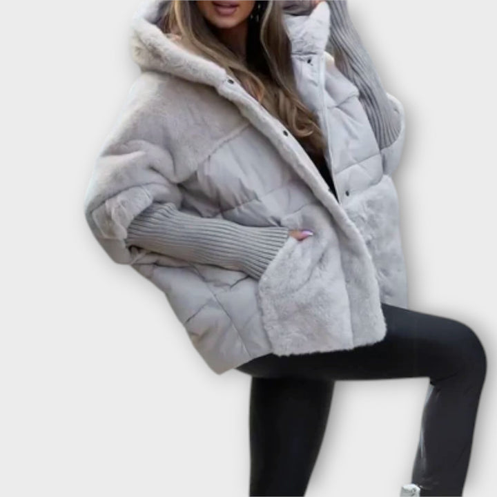 Sophisticated women's quilted puffer jacket, cozy teddy lining provides comfort and elegance.