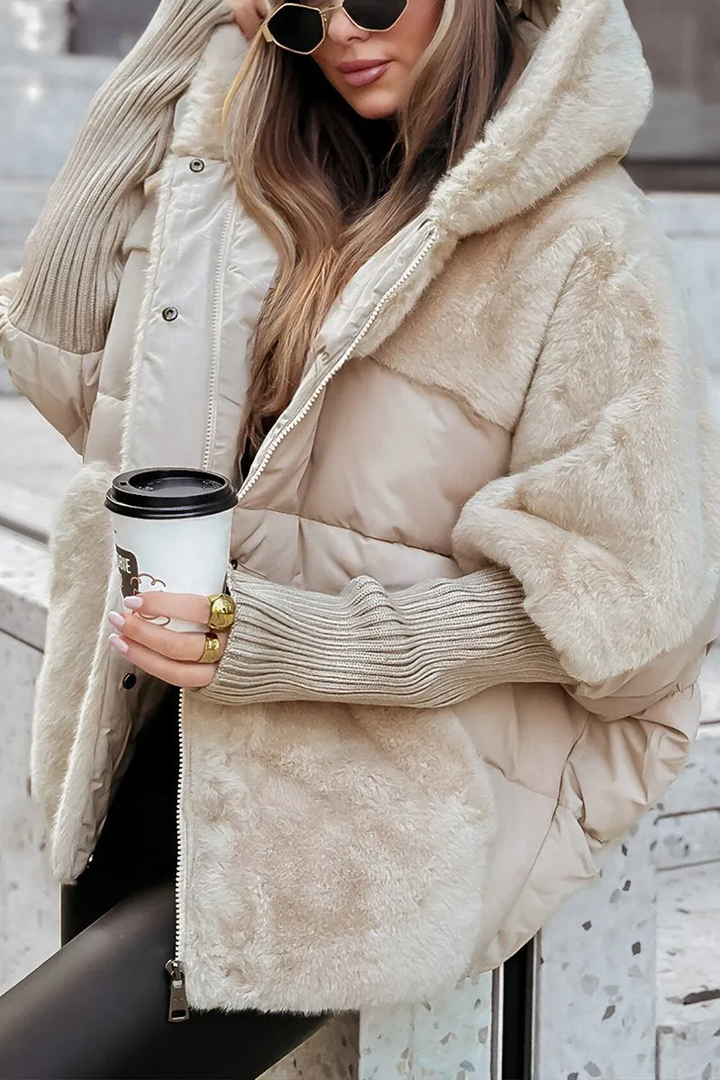 Fashion-forward women's puffer jacket, quilted and lined with cozy teddy for winter outings.