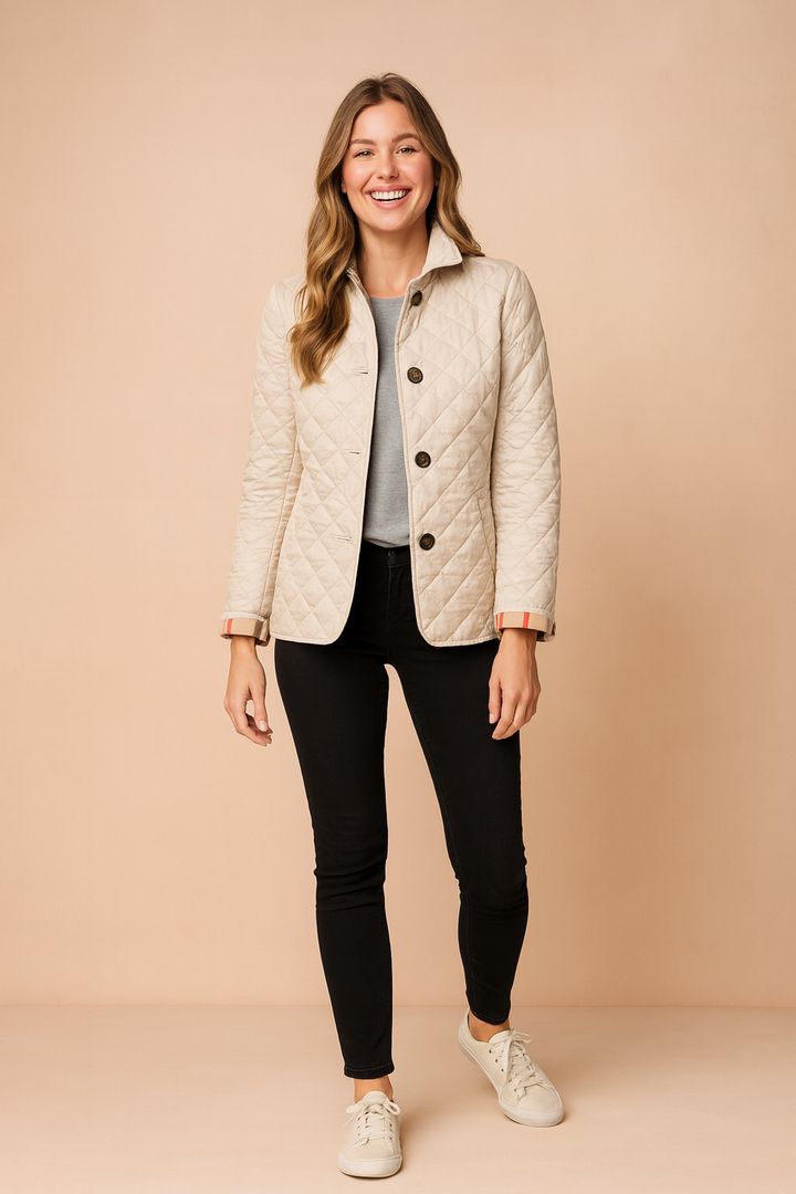 Quilted elegant women's winter jacket, perfect for stylish cold weather and sophisticated ladies outerwear.