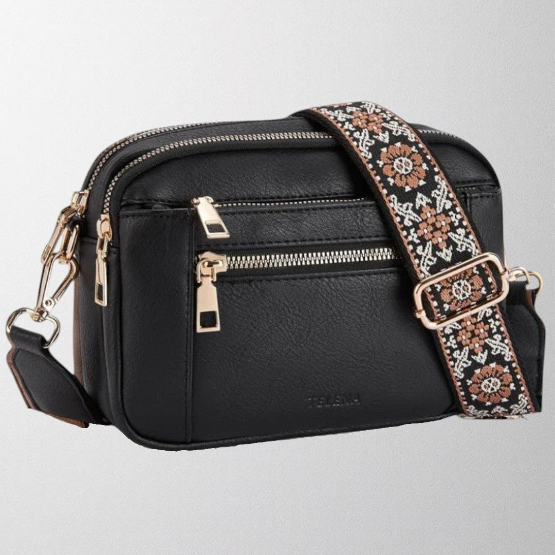 Stylish women's crossbody handbag with a refined design, showcasing its elegant shape