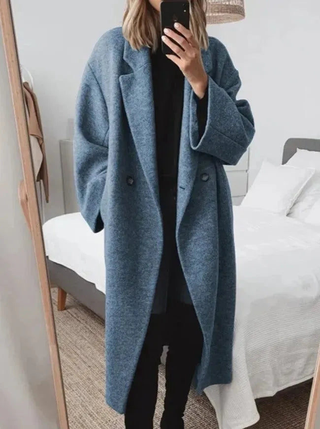 Fashionable women's long double-breasted coat, perfect for fall and winter outerwear.