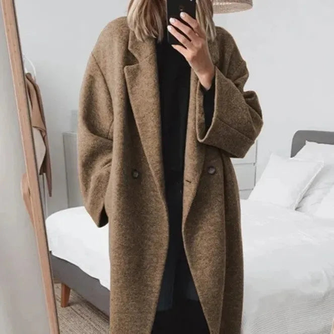 Chic women's relaxed fit longcoat, featuring a stylish double-breasted design.
