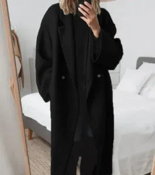 Sophisticated women's long double-breasted coat, ideal for elegant winter fashion.