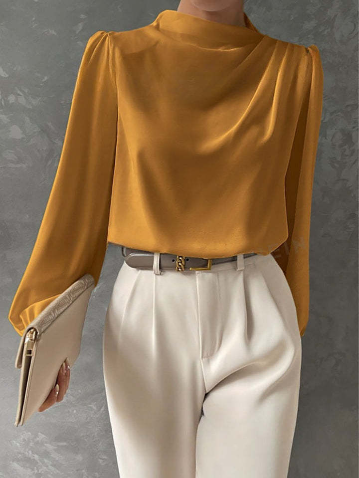 Versatile black long sleeve chiffon blouse for women, ideal for workwear or elegant casual outfits.