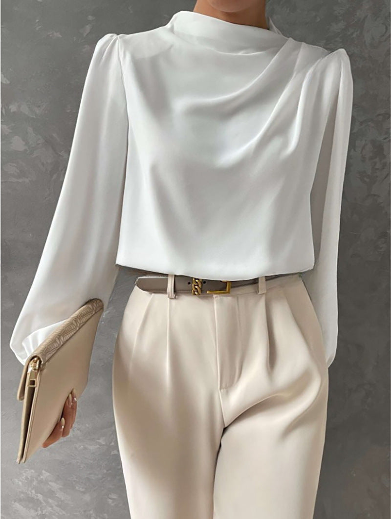 Closeup of the fabric texture of a womens elegant relaxed fit chiffon long sleeve blouse.