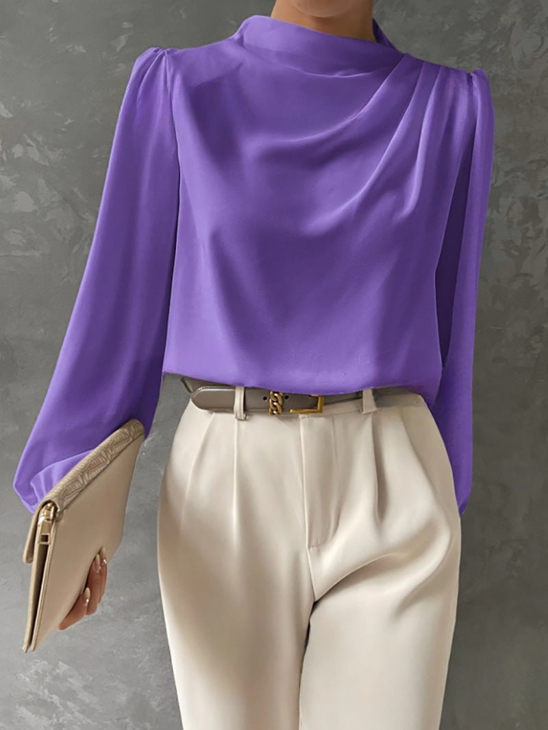 White womens long sleeve blouse, elegant relaxed fit, a staple for business casual wear.