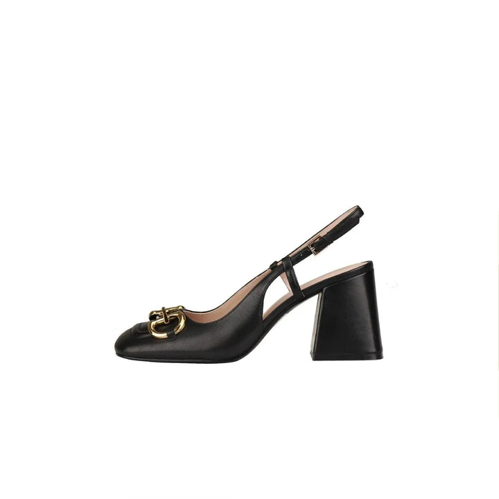 Classic women's high heels with a vintage buckle. Elegant and timeless footwear for any event.