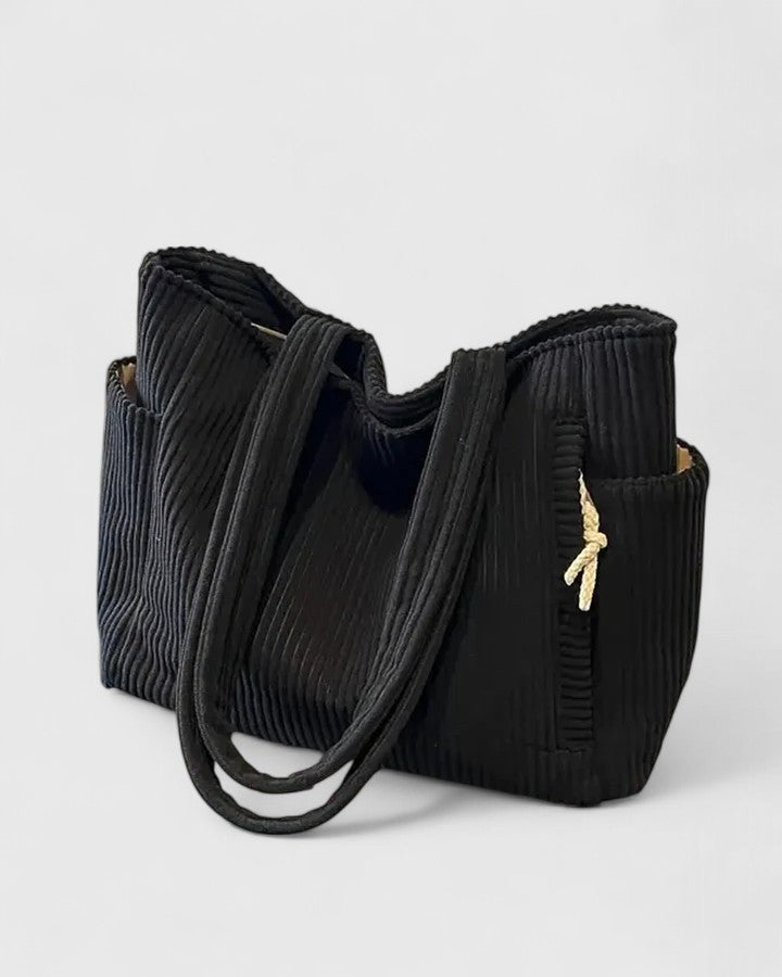 Elegant women's ribbed structured handbag, perfect everyday fashion accessory.