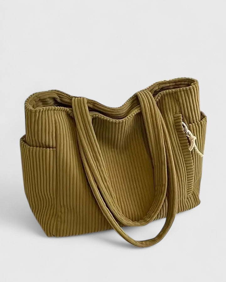 Fashionable women's ribbed handbag, a textured and structured everyday purse.