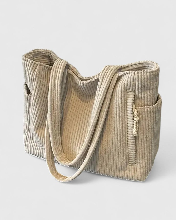 Chic women's structured handbag with ribbed design, ideal for a refined look.