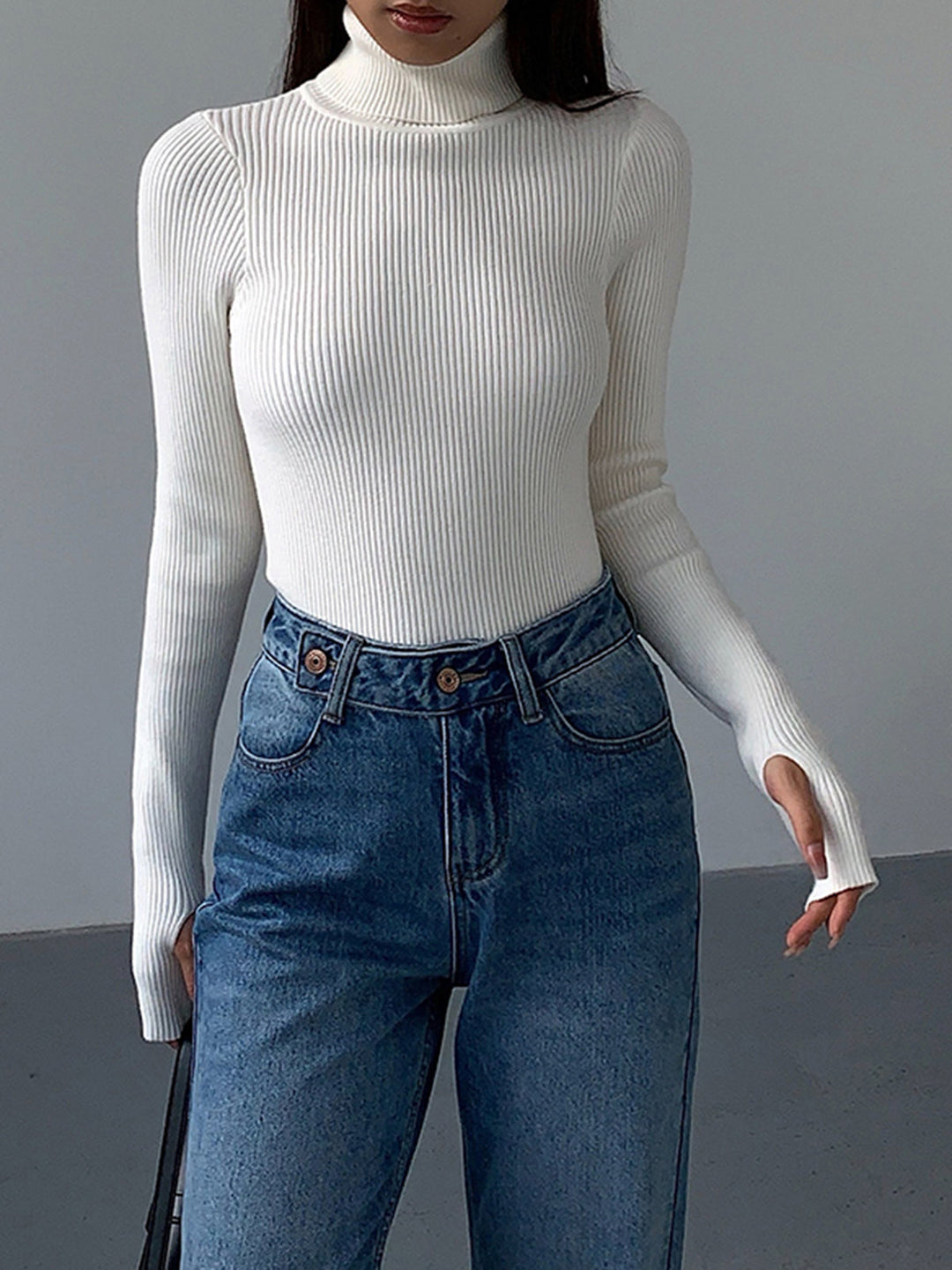 Women's apparel: a chic ribbed turtleneck sweater, an essential for your spring clothing collection.