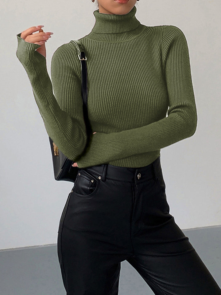 Full shot of a women's ribbed turtleneck sweater, showcasing its length and silhouette for spring.