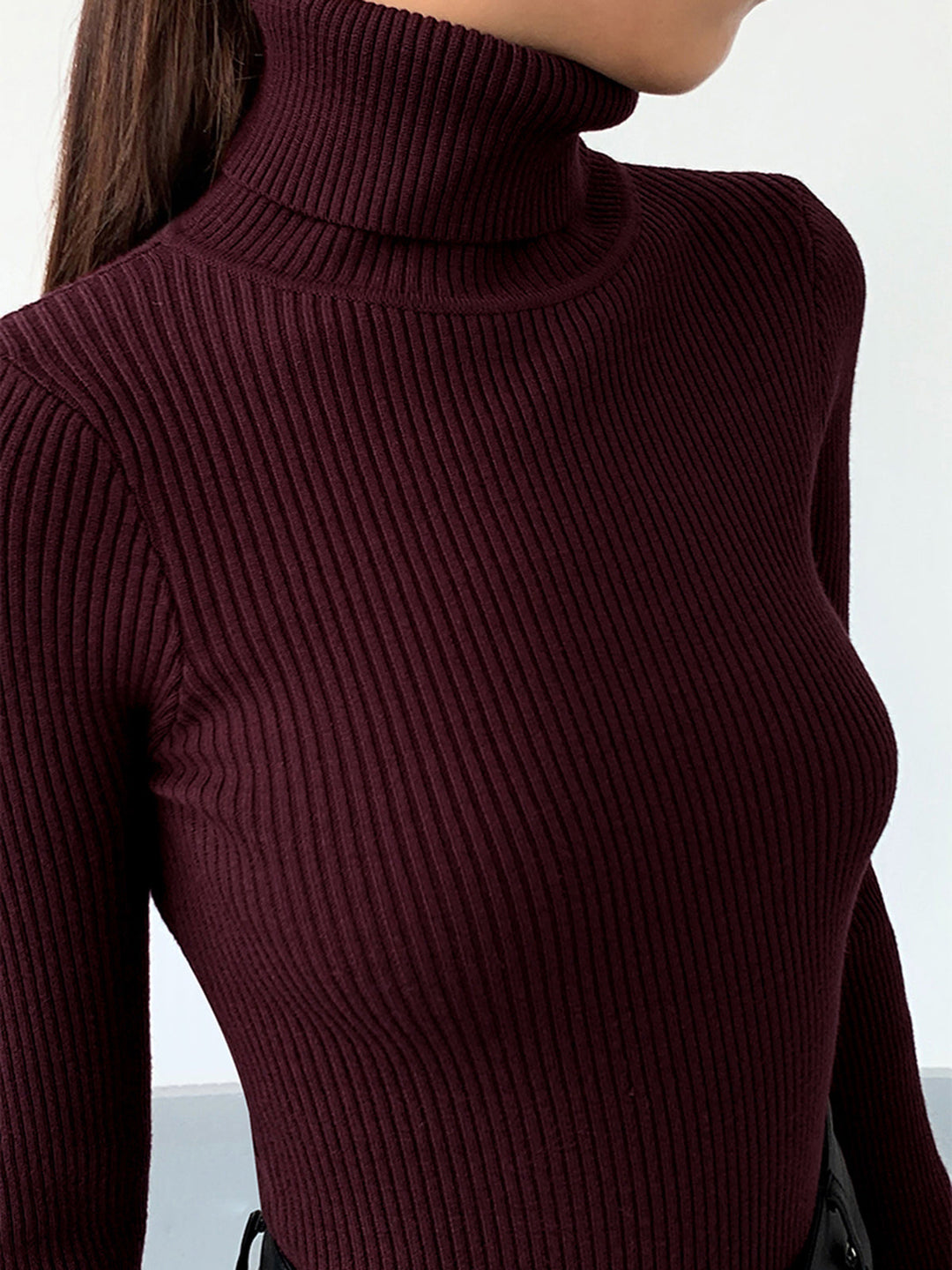 Ribbed knit long sleeve turtleneck sweater for women, a versatile piece for spring casual wear.