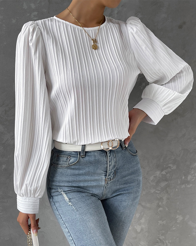 Elegant women's round neck shirt, long sleeve, classic style, perfect for versatile wear & casual chic.