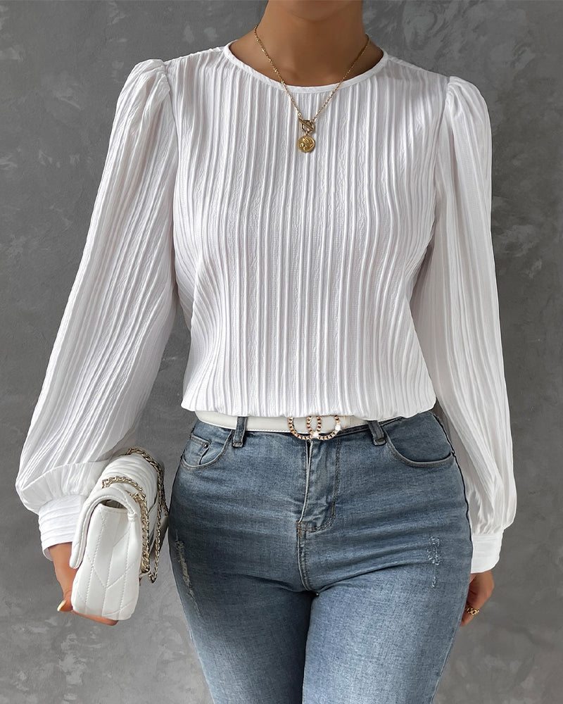 Flattering elegant women's round neck shirt. Long sleeve blouse with a classic fit for timeless ladies fashion.