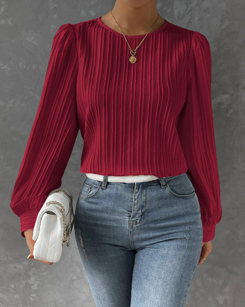 Classic women's round neck shirt, elegant long sleeve top for versatile wear. Perfect for casual chic fashion.