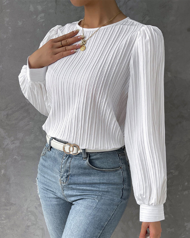 Comfortable ladies round neck blouse. Long sleeve, versatile for timeless fashion. Elegant women's top.