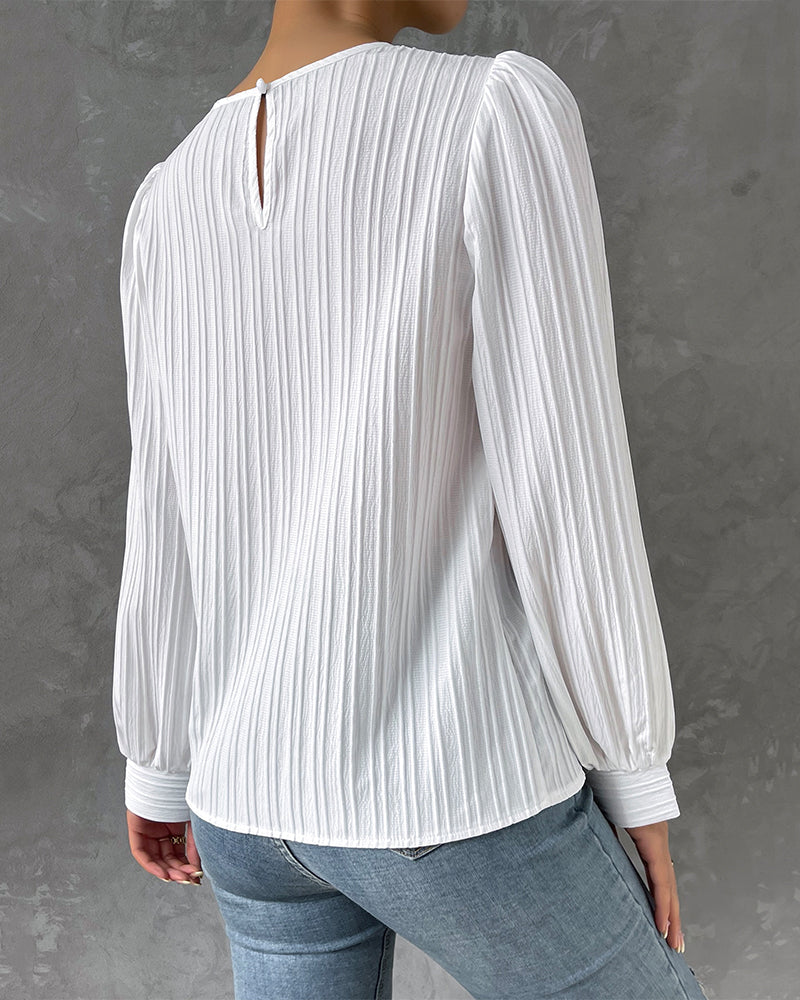 Stylish women's round neck top, long sleeve. Elegant blouse for casual chic fashion. Versatile ladies shirt.