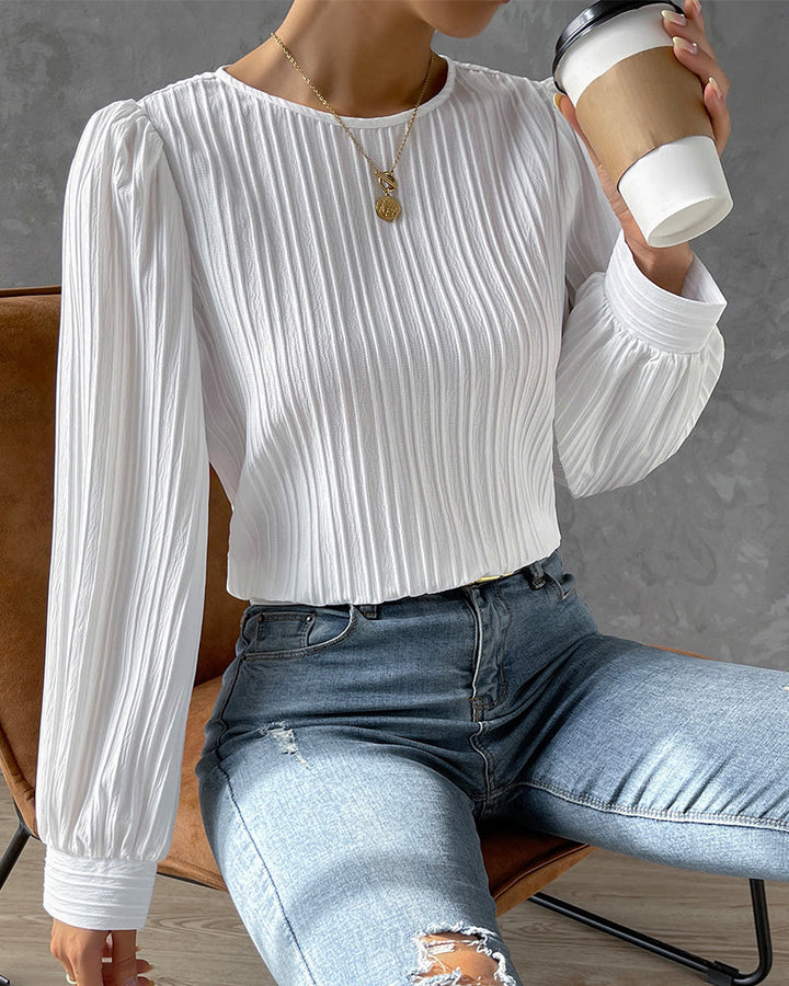 Versatile women's elegant round neck shirt. Long sleeve classic blouse for office or casual chic ladies style.
