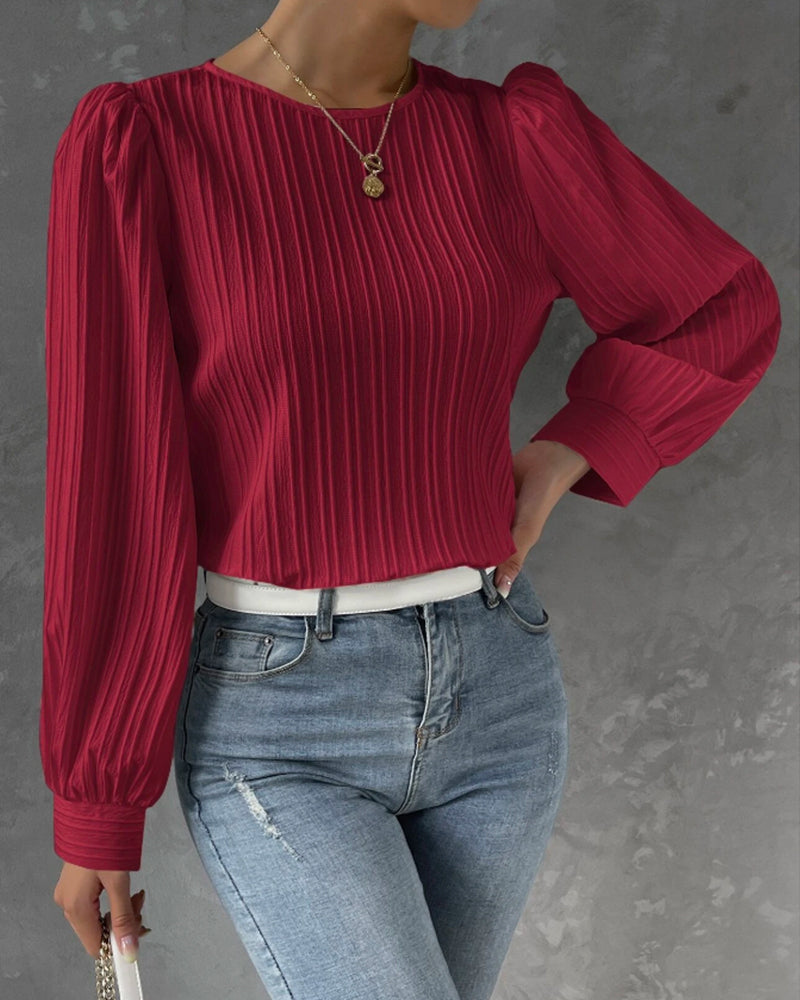 Fashionable ladies round neck shirt. Elegant long sleeve top, classic style for versatile and chic women's outfits.