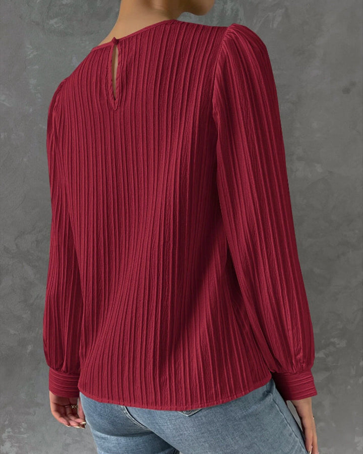 Elegant women's round neck long sleeve shirt, showcasing classic style & comfortable fit for versatile fashion.
