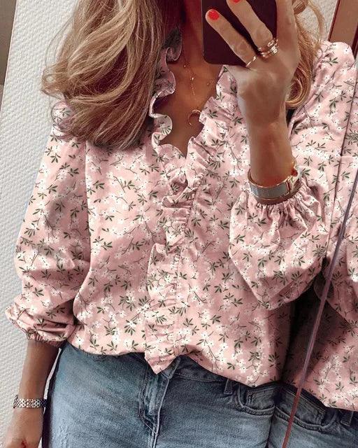 Fashionable women's summer blouse with delicate ruffle details and a flattering V-neckline. Casual elegance.
