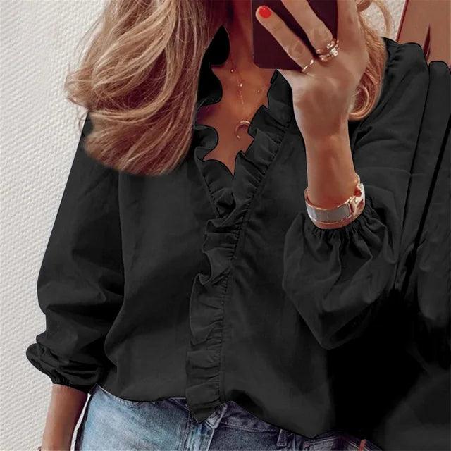 White women's V-neck ruffle top, ideal for summer fashion and relaxed casual wear. Soft fabric.