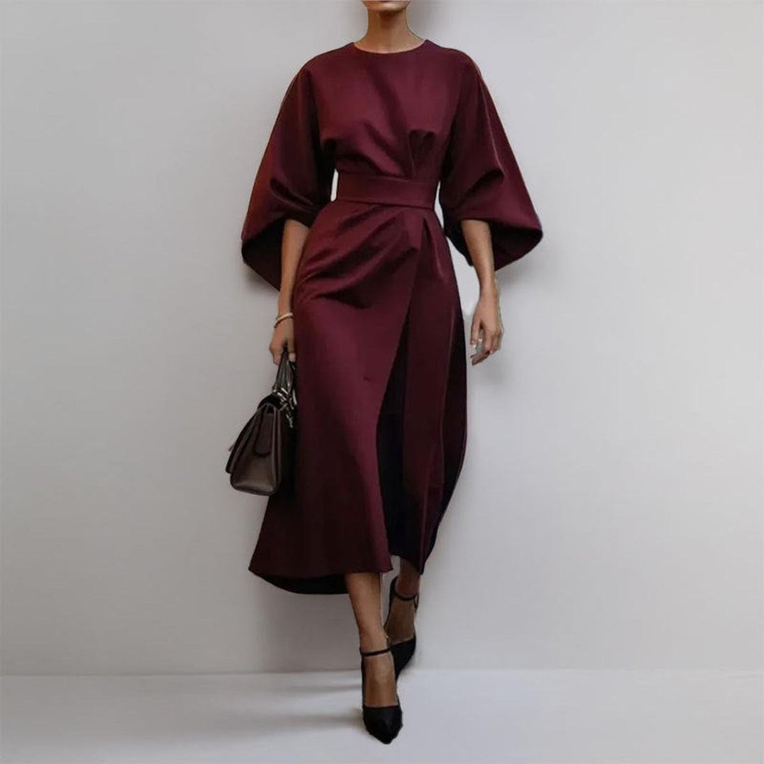 Close-up of the luxurious satin feel fabric on a women's batwing sleeve maxi dress.