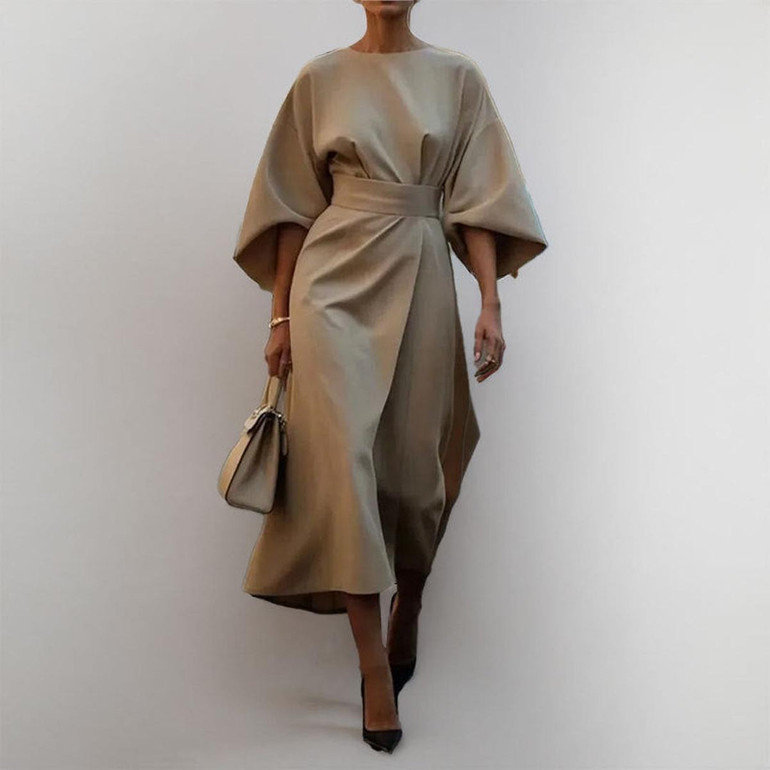 Sophisticated women's batwing sleeve maxi dress in satin feel fabric, suitable for evening.
