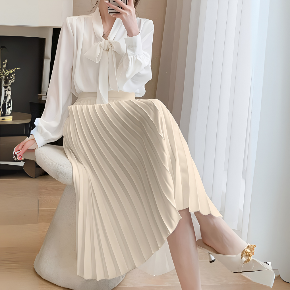 Luxurious pleated satin midi skirt for women, featuring a chic high-waist and elegant drape.
