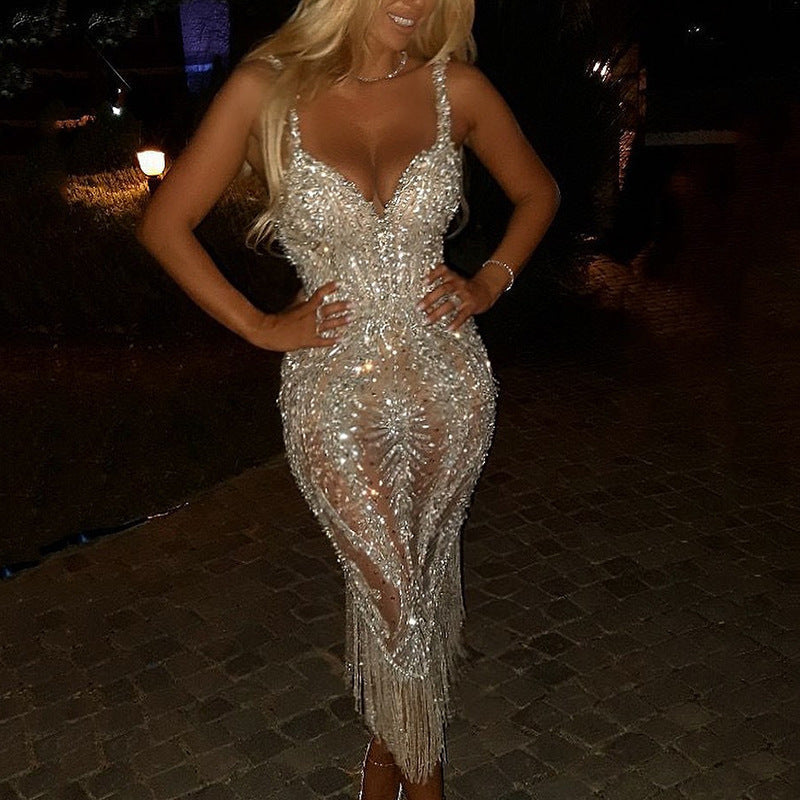 Luxurious sequin V-neck midi dress, tailored for an elegant women's silhouette. Sleeveless & sophisticated.
