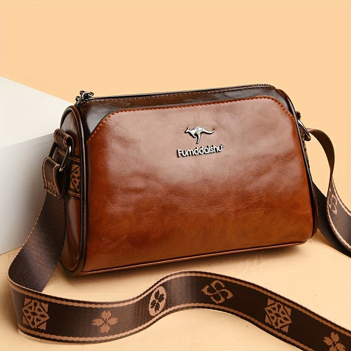Chic women's shoulder bag featuring an adjustable strap & multiple compartments. Elegant for daily use.