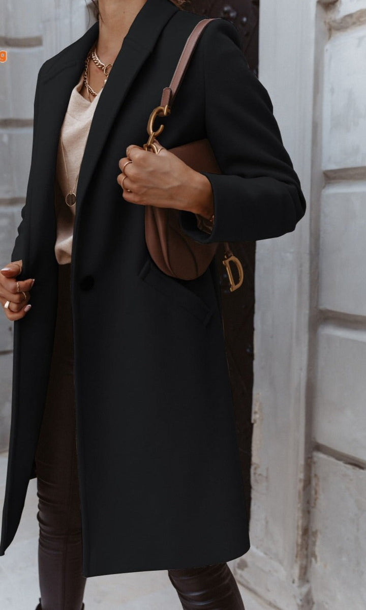 Stylish women's elegant formal coat with classic buttons, suitable for business and winter outerwear.
