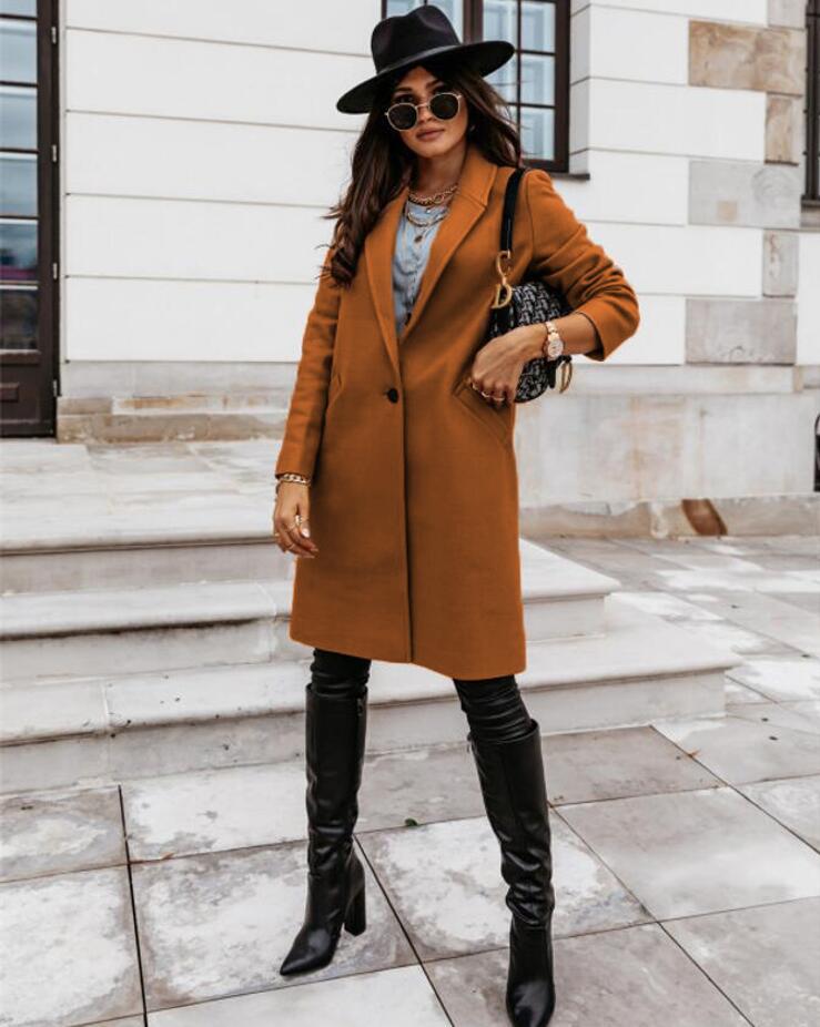 High-quality fabric detail of a women's formal single-breasted long coat, emphasizing its elegance.