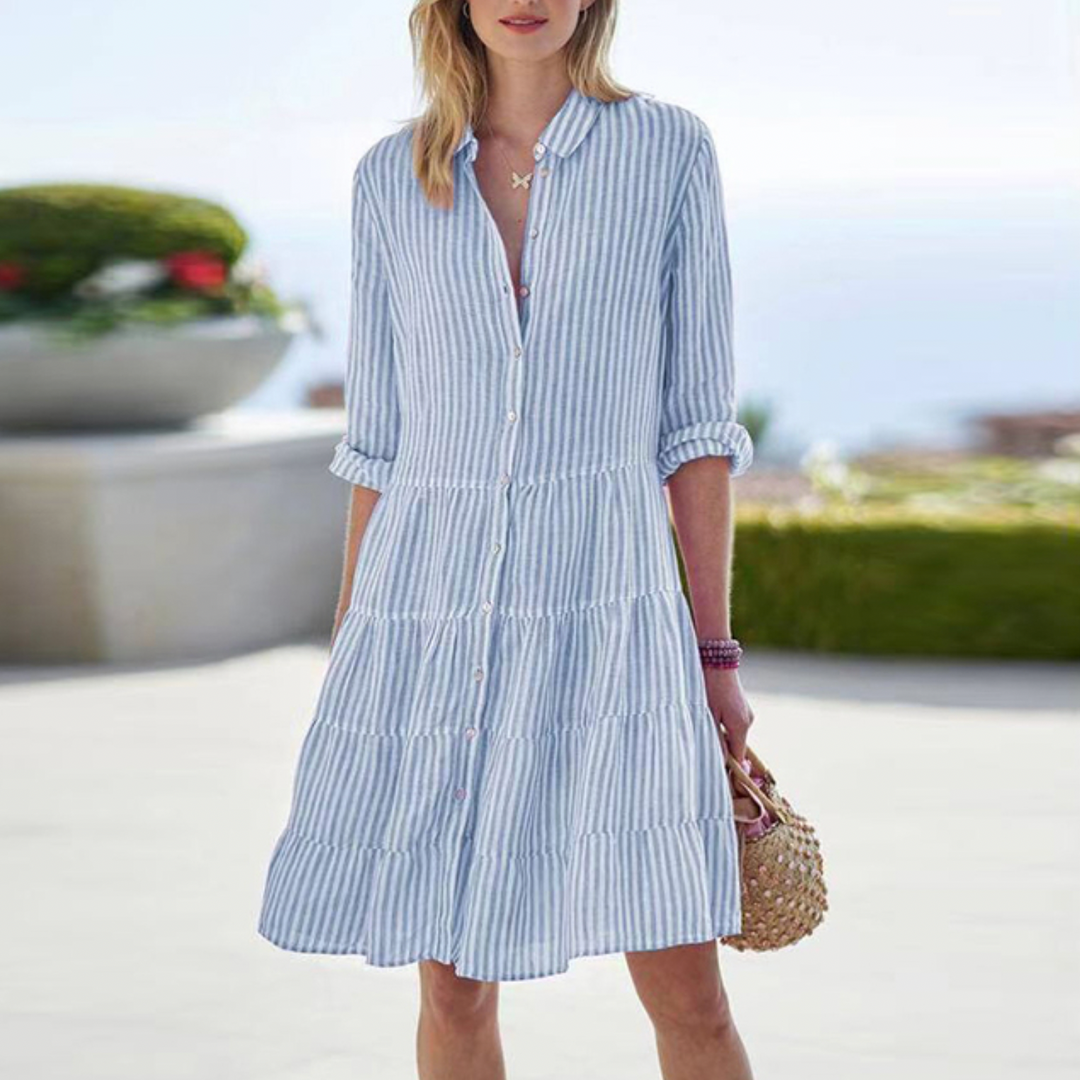 Elegant women's sleeveless casual summer dress in a lightweight, airy fabric, perfect for beachwear fashion.