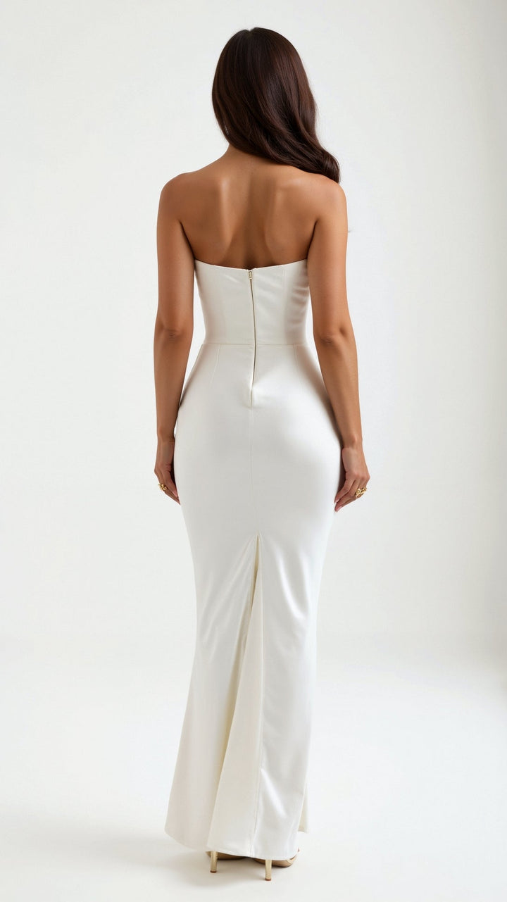 Model wearing a women's column maxi dress, styled for a wedding guest or elegant event.