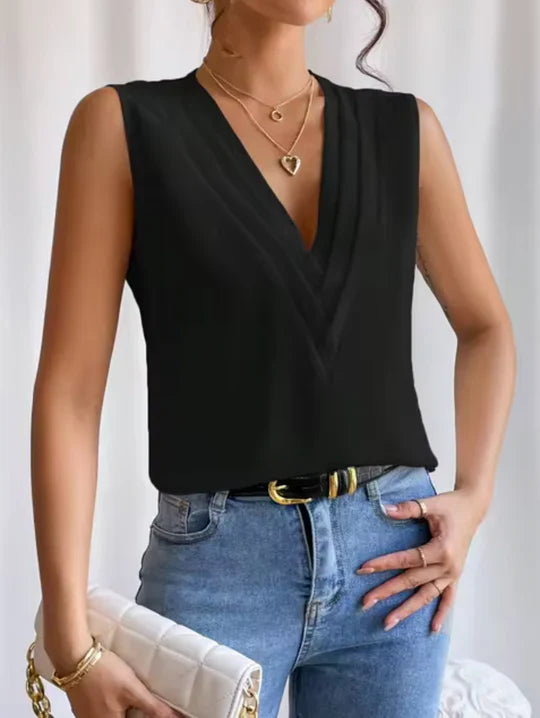 Close-up of a women's elegant V-neck top, highlighting the sleeveless design and soft polyester blend