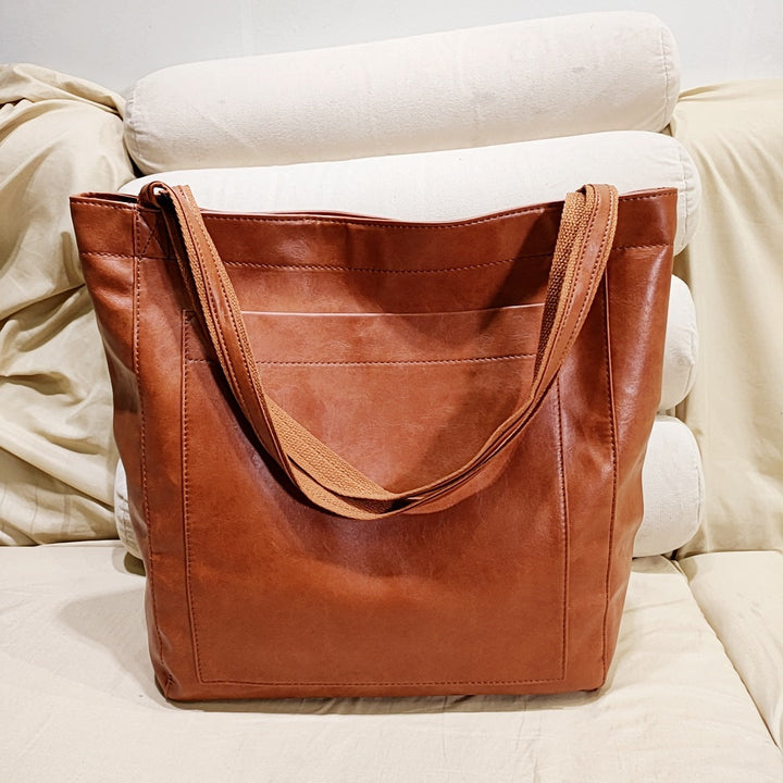 Elegant women's soft leather shoulder bag in brown, a versatile fashion accessory for daily use.