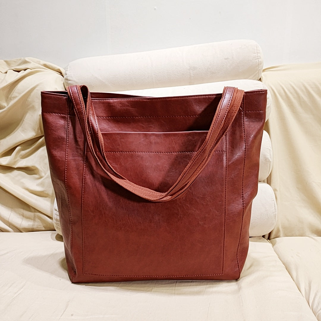 Stylish black leather crossbody bag for women, featuring a sleek design and durable material.